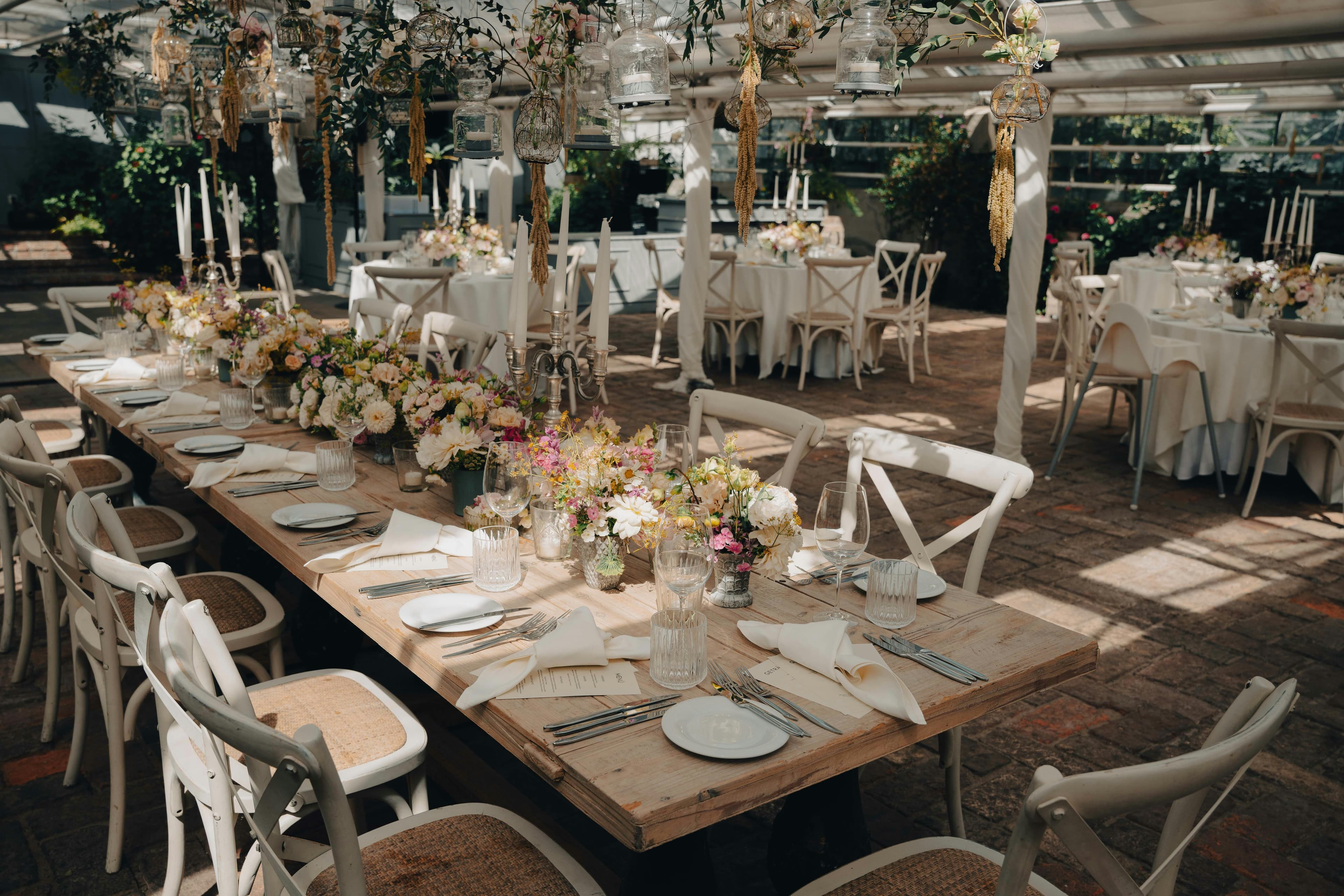 Reception tables set with flowers and candles