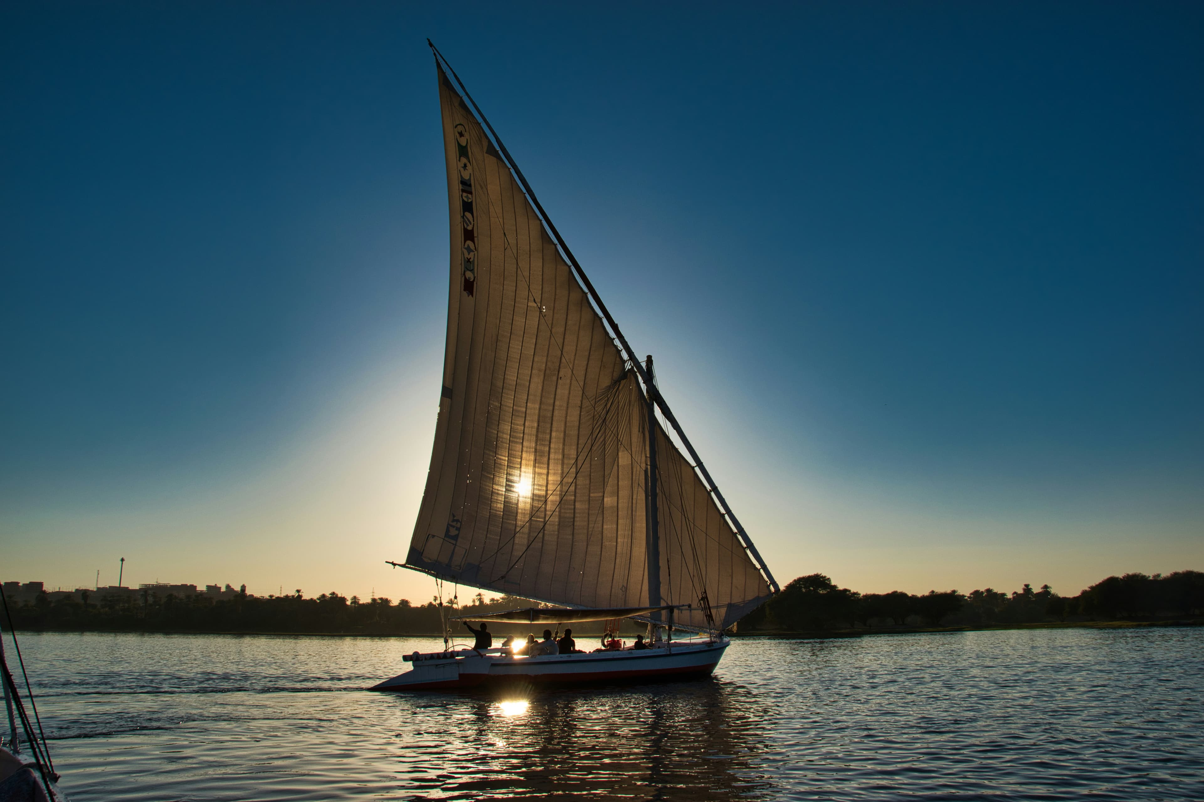 A felucca sailing on the Nile at sunset