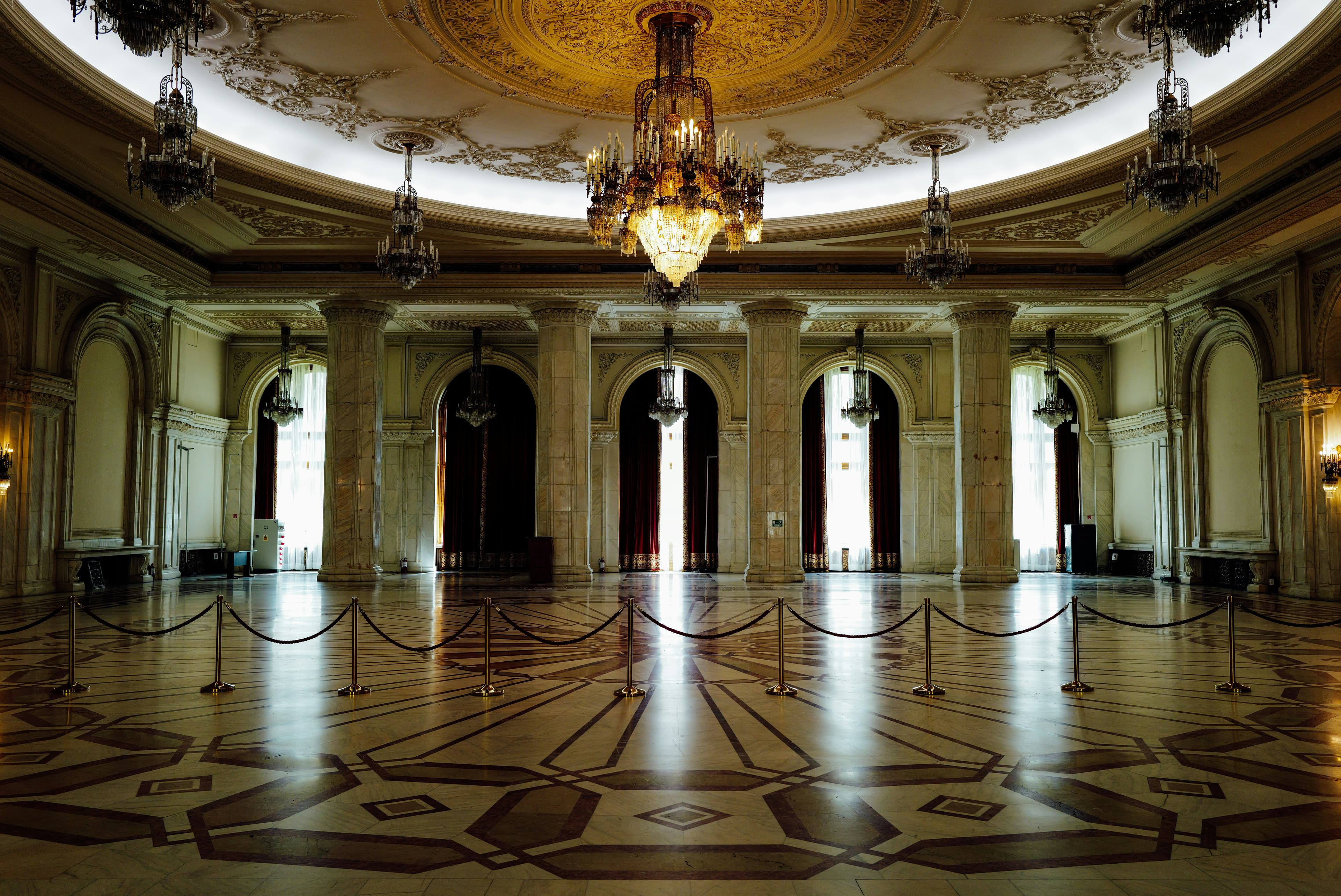 A marble rotunda with a crystal chandelier